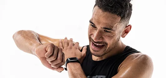 a person stretching his arm