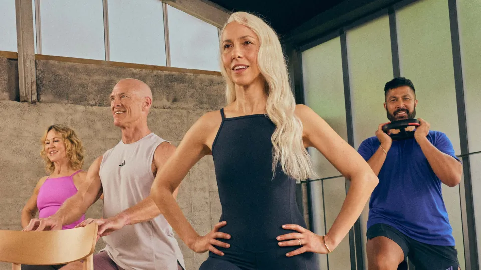 a group of people in a fitness studio performing exercises