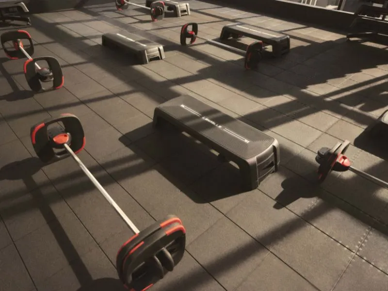 SMARTSTEP equipment arranged neatly in a fitness studio, ready for class use.