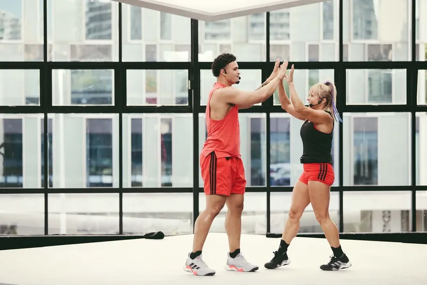 two instructors high-fiving