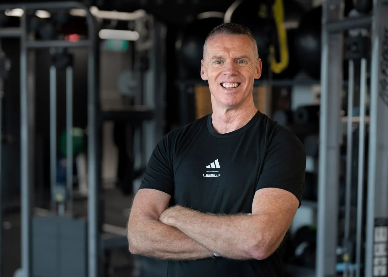 Brett Sutton, Les Mills New Zealand CEO, standing in a gym